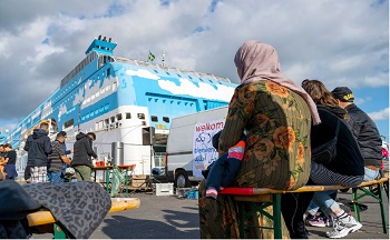 Asielzoekers op een cruiseboot in de haven van Amsterdam, 2022 | Foto: ANP/Hollands Hoogte, Sabine Joosten