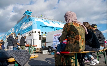 Asielzoekers op een cruiseboot in de haven van Amsterdam, 2022 | Foto: ANP/Hollands Hoogte, Sabine Joosten